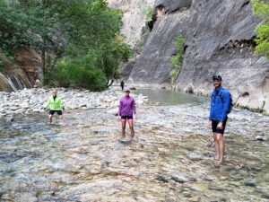 hiking the narrows in Zion - photo credit Ron Yaw