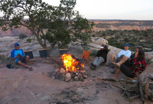Guests enjoying the camping fire on a Maze Mountain Bike Tour with Escape Adventures