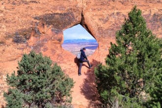 A guest enjoying the views on Best of Moab Mountain Bike tour with Escape Adventures