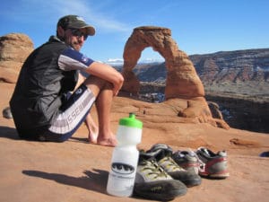 A guest enjoying the views of the arches on Best of Moab Mountain Bike tour with Escape Adventures