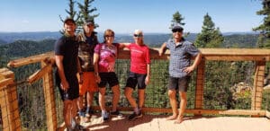 Happy Guests Posing at a View Point on the Brian Head Mountain Bike Tour | Escape Adventures